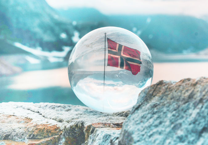 norway flag reflected in a glass sphere