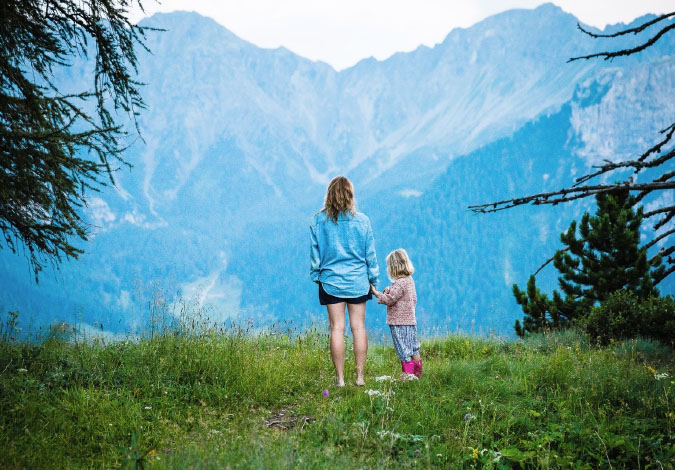 mother and daughter in mountains